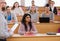 Lecturer and multinational group of students in an auditorium