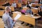 Lecturer and multinational group of students in an auditorium