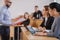 Lecturer and multinational group of students in an auditorium