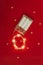 Led lights decorative garland on red background. Christmas holidays and electrical appliances concept