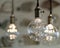 LED pendant lights with round glass balls, brass sockets, glowing, hanging from the ceiling 8x10