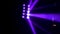 LED spotlight with purple beams, modern party illumination equipment. Stock. Colourful party projector swinging from