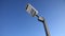 Led streetlight on high metal pole under clear blue sky