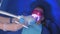 LED whitening beauty cosmetic procedure for woman`s teeth in dentistry studio.