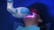 LED whitening beauty cosmetic procedure for woman`s teeth in dentistry studio.