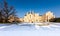 The Lednice castle panorama in snow, winter. Beautiful old historical architecture, blue sky. Czech republic unesco