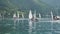 Ledro, Italy. Sailing school on small boats. School on Lake Ledro. Alpine lake. Summer time