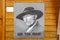Lee Van Cleef portrait hanging on wooden wall at cowboy town