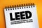 LEED - Leadership in Energy and Environmental Design acronym text on notepad, abbreviation concept background