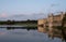 Leeds Castle in Kent UK, reflected in the surrounding moat, photographed in late afternoon on a clear crisp autumn day.