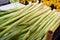 leeks stacked in the greengrocer aisle, leeks ready for sale in the greengrocer