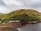 Leenaun, Ireland - 07/16/2020: Aerial view on Leenaun hotel by Kilary fjord. Cloudy sky. Part of Wild Atlantic Way route