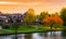 Leerdam the netherlands a typical dutch city view from the park with water, road and grass at sundown in autmun season