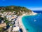 Lefkada Agios Nikitas Beach with tourists on the sandy beach and