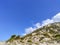 Lefkada cliffs with trees and bright blue sky