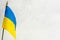 In the left corner of the photo is the state flag of Ukraine on a white background. There is free space to insert. Peaceful state