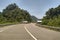 Left and right view of the highway passing through the tropical forest