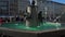 Left to right pan real time establishing shot of the famous fish fountain on the Marienplatz in Munich, Germany.