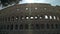 Left to right Timelapse pan shot of Colosseo in Rome. The Colosseum also known as the Flavian Amphitheatre. An oval