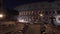 Left to right Timelapse pan shot of night traffic nearby the Colosseo in Rome. The Colosseum also known as the Flavian
