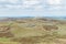 From left to right a view of Emsworthy Rocks, Saddle Tor and Haytor across moorland of Dartmoor National Park, Devon, UK