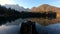 Left truck low angle Laghi di Fusine lake with reflection of Alps mountains