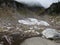 A leftover snowfield in a valley