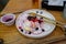 Leftovers Homemade Fluffy Japanese Pancakes with berry sauce and ice cream topping on a white plate