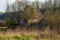 Leftovers of stone block building in summer green meadow