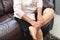 Leg cramp, senior woman suffering from leg cramp pain at home, health problem concept