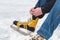 Leg in shoe of female skate lies on ice