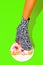 Leg in zebra Party Boots crush yummy cake. Minimal fashion food art