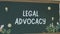 Legal Advocacy inscription on chalkboard background. Graphic presentation of drawn teacher and student standing at