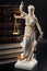 Legal code, enforcement of the law and blind Iustitia concept with statue of the blindfolded lady justice  Dike in Greek and