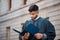 Legal, research and a lawyer man reading documents on a city street in preparation of a court case or trial. Law, study