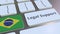 Legal Support text and flag of Brazil on the computer keyboard. Online legal service related 3D animation
