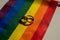 Legalization of same-sex marriages. Rainbow flag and wedding rings.