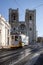 The legendary yellow tram 28 runs in the old town of Lisbon, Alfama, cityscape from Portugal