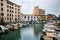 LEGHORN, ITALY - OCTOBER 3, 2017: Boats moored on canal in Venezia Nuova district of Livorno, Tuscany. Travel impressive cityscape