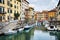 LEGHORN, ITALY - OCTOBER 3, 2017: Boats moored on canal in Venezia Nuova district of Livorno, Tuscany. Travel scenic cityscape