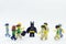 lego batman standing in the crowd of minifigures people
