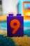 Lego Duplo block with number nine