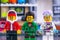 Lego Hidden Side set. Three Lego minifigures - Jack Davids, J.B. and Douglas Elton on J.B.â€™s Ghost Lab