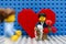 Lego man with ring and flowers meeting his girlfriend