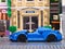 Lego McLaren Elva car by LEGO Speed Champions with driver inside on city street