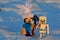 LEGO Minecraft action figure of Steve with pickaxe and white knitted large wooly cap attacking skeleton archer.