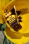 LEGO Minecraft figure of Beekeeper standing in chalice of yellow Tulip flower with golden shovel in left hand