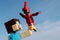Lego Minecraft large action figure of main character Steve with red parrot on his left hand.