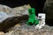 LEGO Minecraft monster mobs, Skeleton and Creeper, sitting in front of mountain cave.