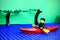 Lego mini-figure rowing boat across the river